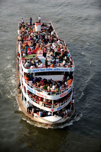 People risk over crowded passenger ships to reach home during Eid. Image by Maji, copyright Demotix (26/11/2009).